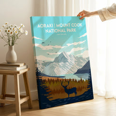 Aoraki Mount Cook National Park travel poster canvas print with mountain, deer, and scenic landscape in a sunlit room.
