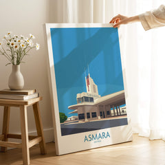 Asmara Eritrea Print – Fiat Tagliero Poster showcased in a bright, modern interior with floral decor.