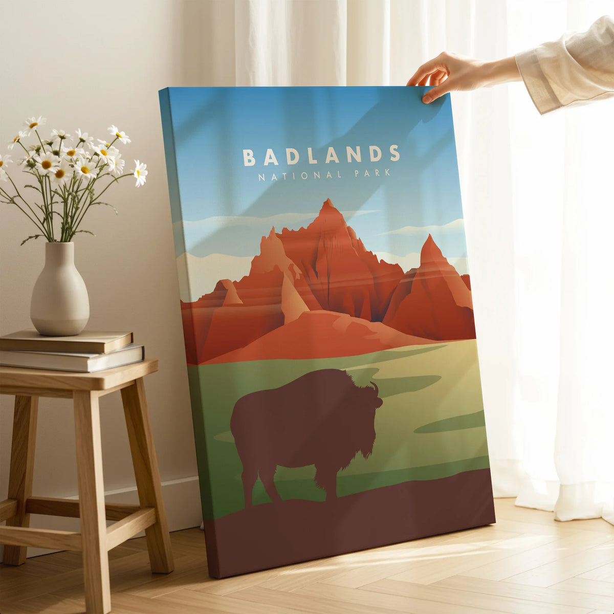 Badlands National Park wall art print with bison silhouette, held in cozy room setting