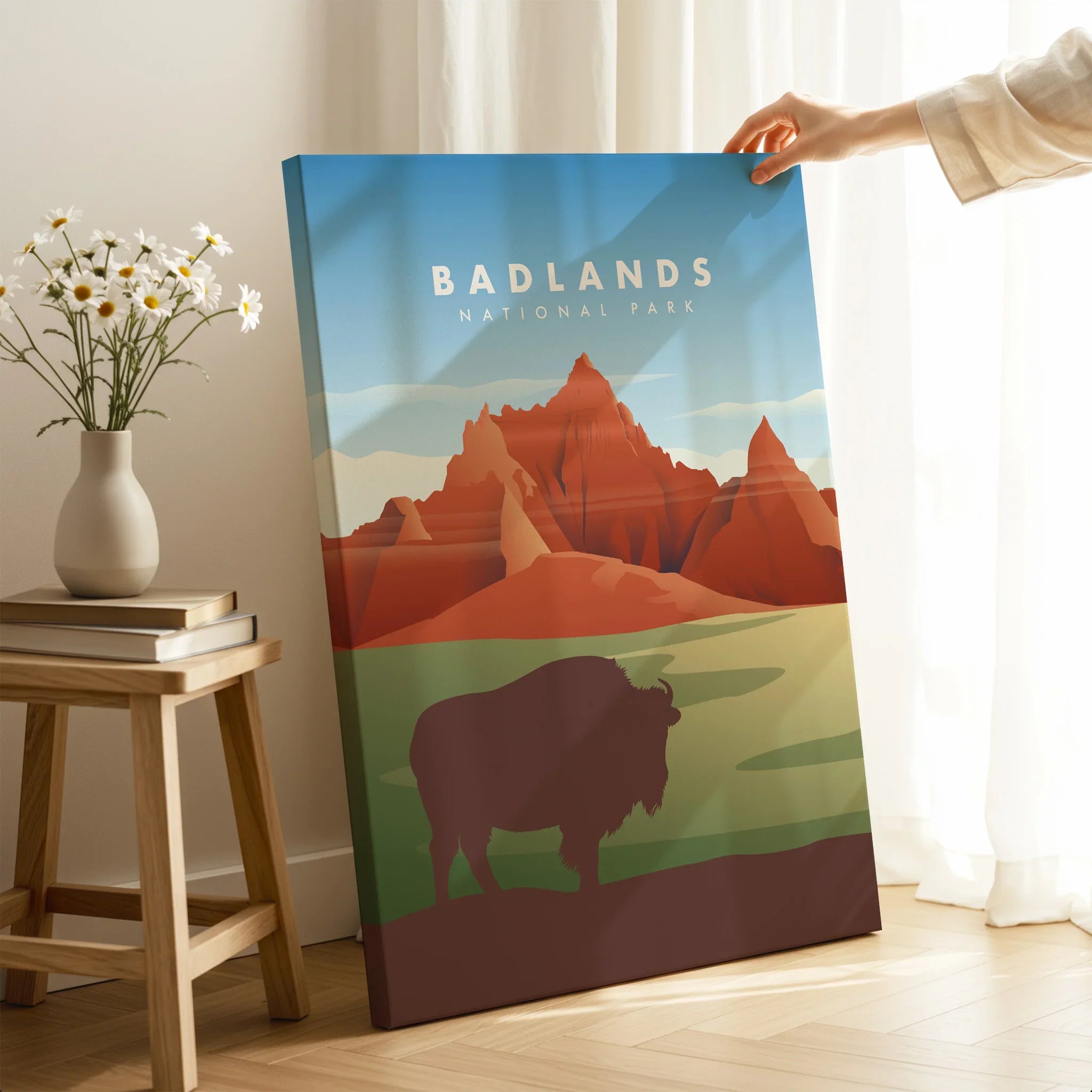 Badlands National Park wall art print with bison silhouette, held in cozy room setting