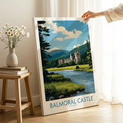 Hand holding Balmoral Castle Scotland travel poster canvas print in modern living room