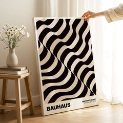 Bauhaus Exhibition Prints - Thick Undulating Waves Poster Black Cream Abstract Art displayed in home setting.