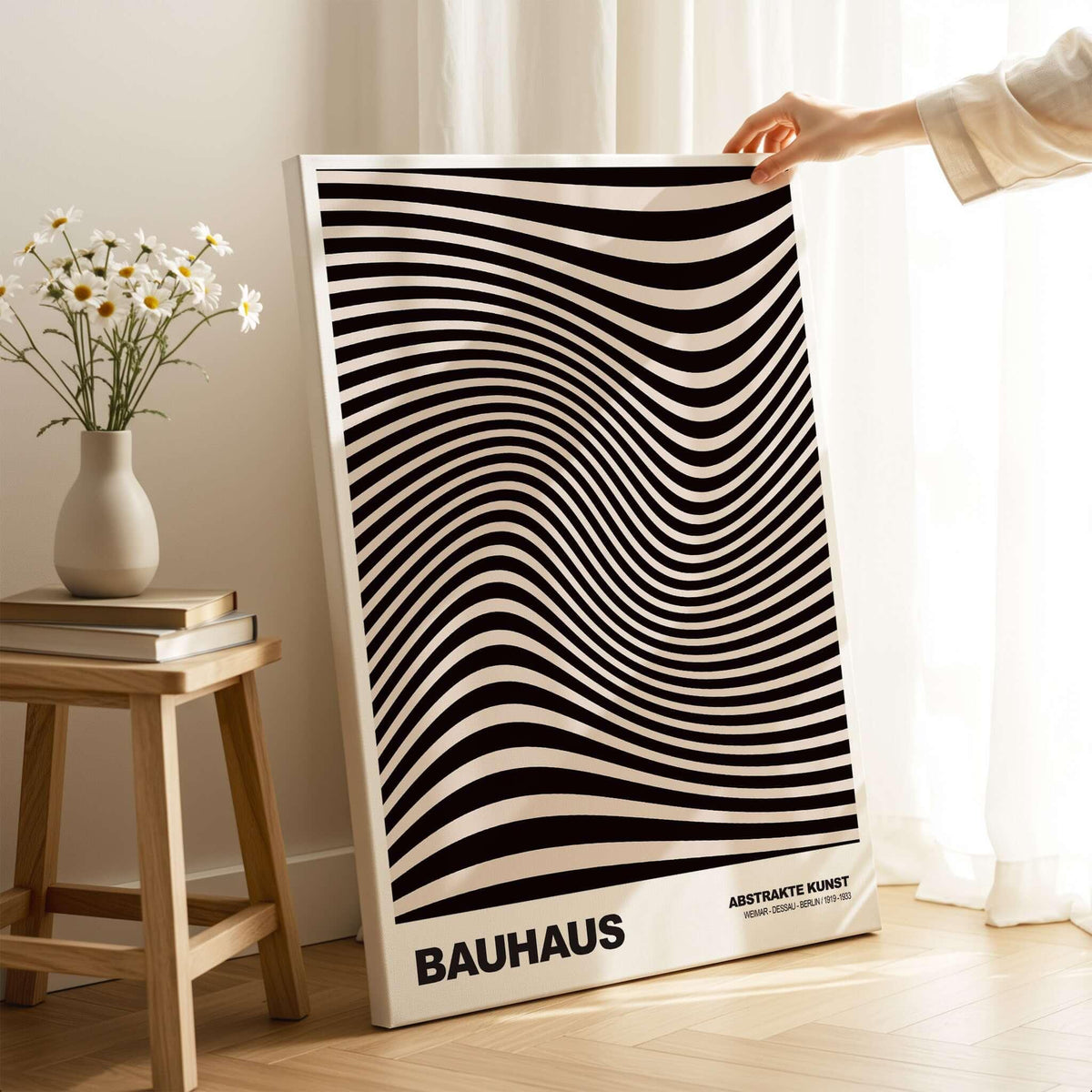 Bauhaus Exhibition Prints -  Optical Wave Lines Art Print Black Cream Abstract displayed in a bright room with a flower vase.