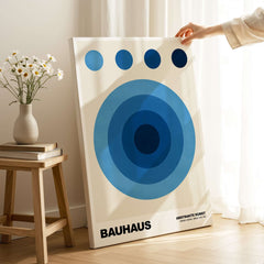 Bauhaus Exhibition Prints - Abstract Blue Circles Poster Geometric Design showcased in a bright interior setup.
