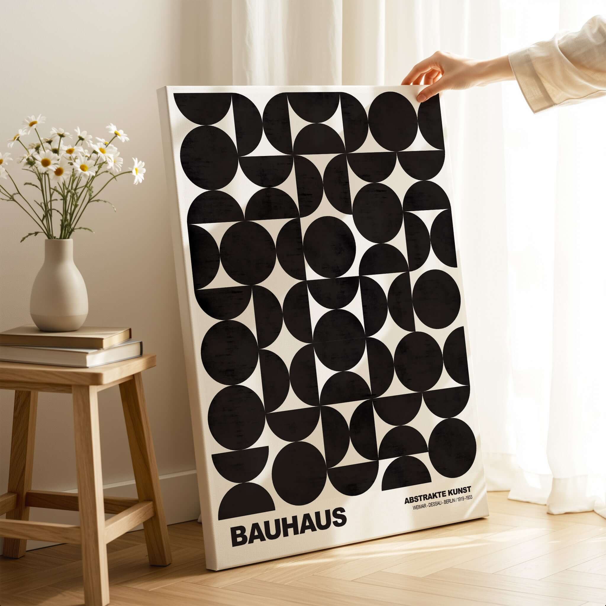 Bauhaus Exhibition Prints - Geometric Circle Shapes Art Print Black White Pattern displayed on a wooden table with flowers.
