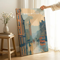 Hand holding Birmingham England travel poster canvas print with rainy cityscape, home decor