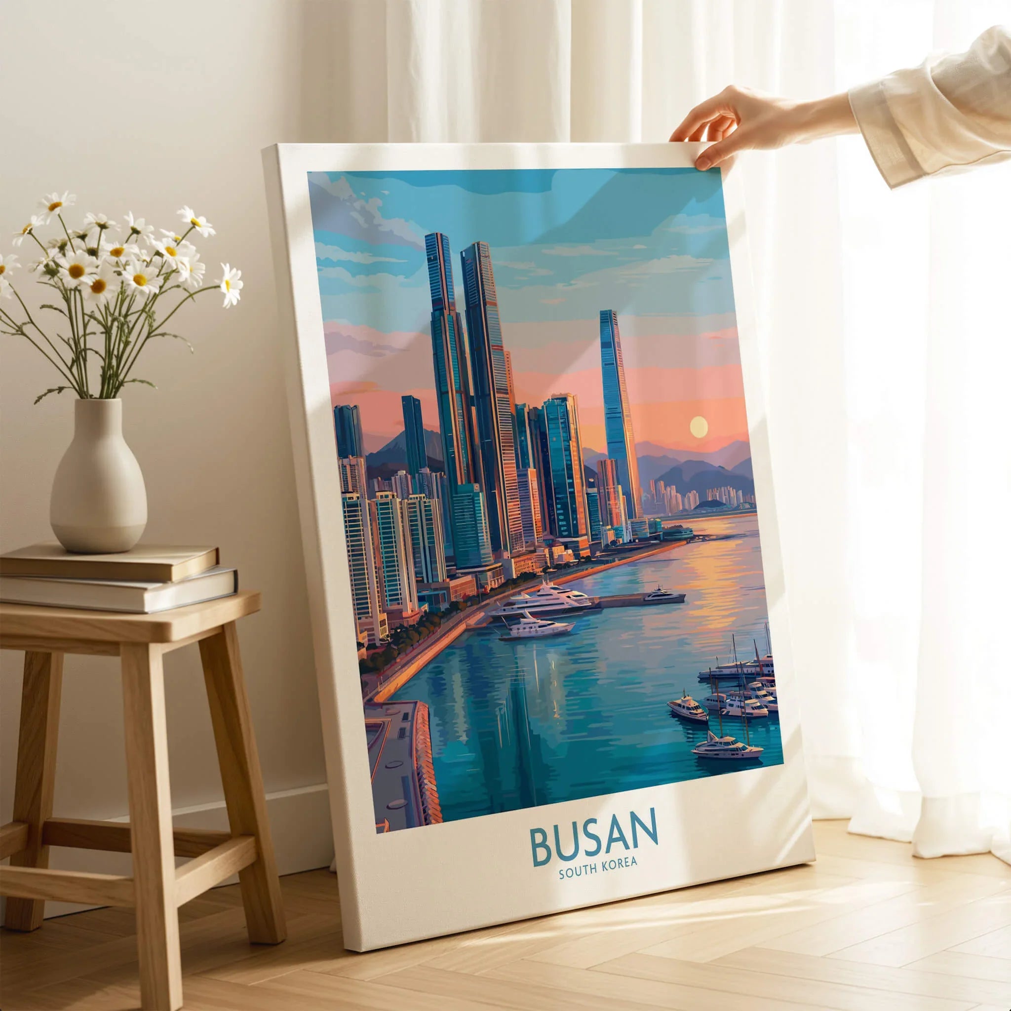 Busan city skyline wall art print with harbor view, hand holding canvas in bright room setting