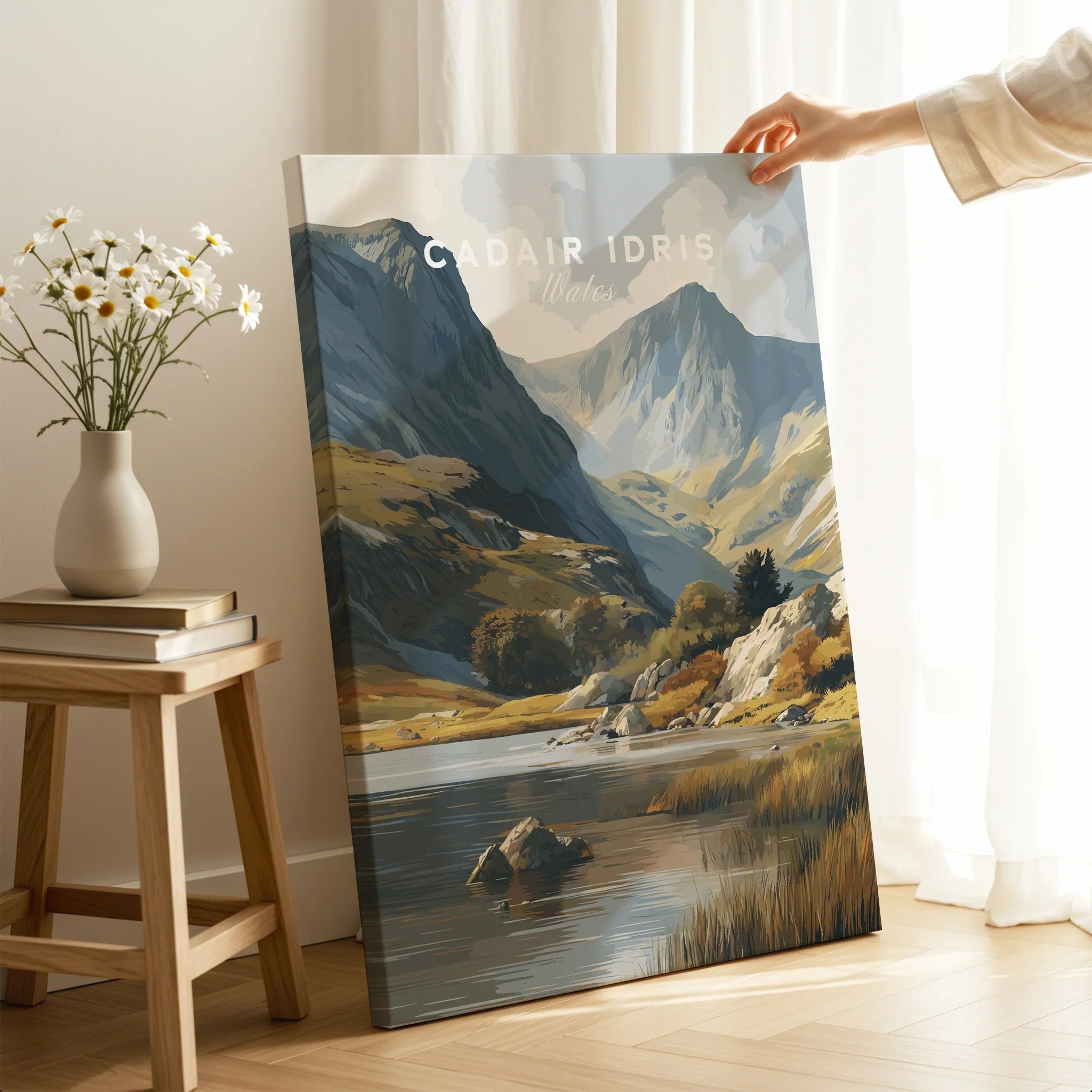 Hand holding a canvas print of a scenic Cadair Idris mountain landscape for home decor