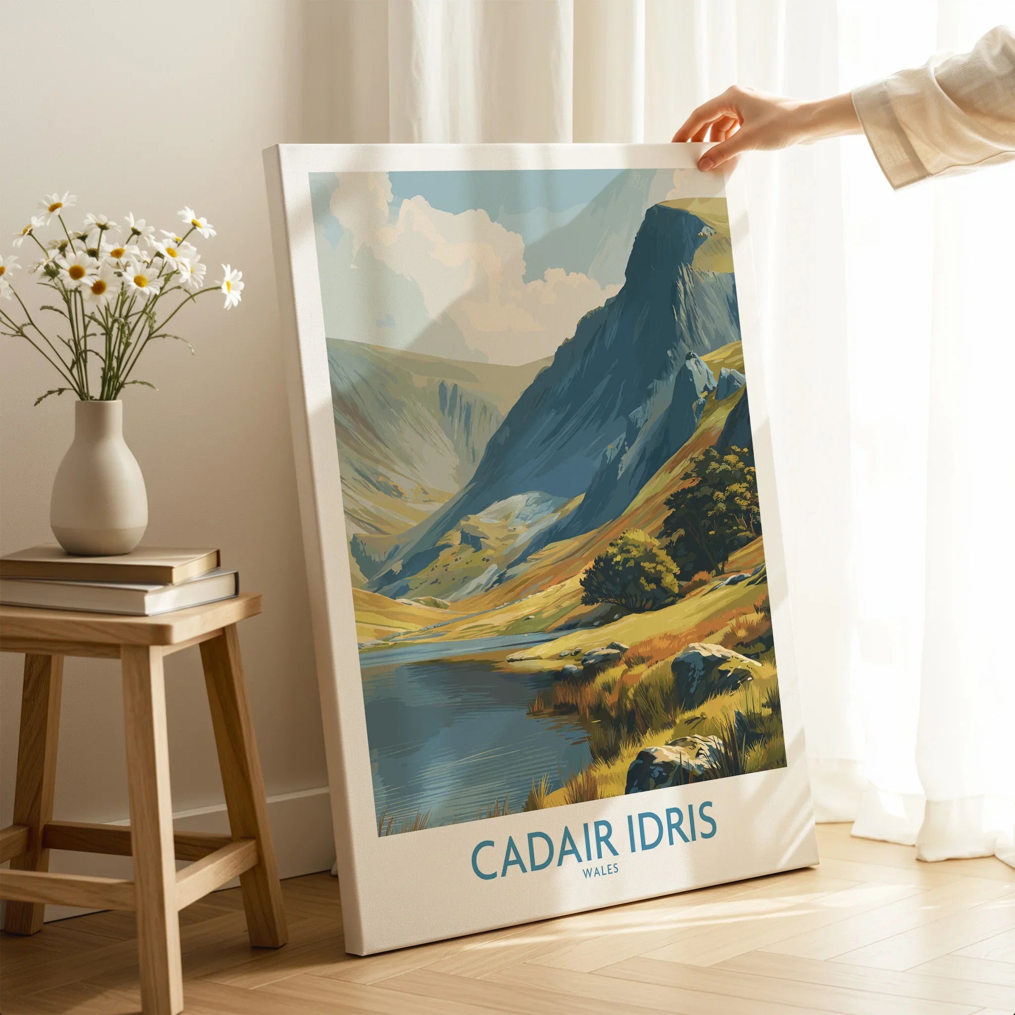 Hand holding canvas wall art print of Cadair Idris Wales landscape in bright living room