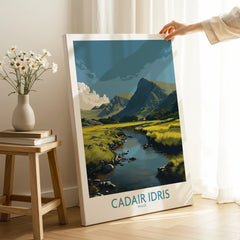 Hand holding canvas print of Cadair Idris mountain landscape in modern room decor