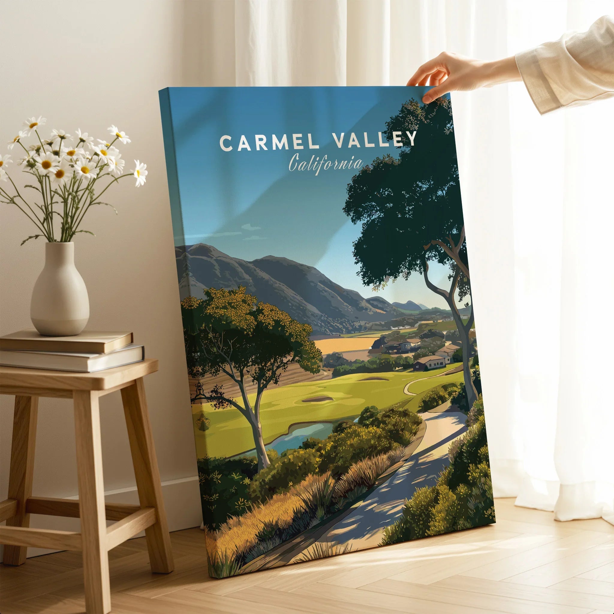 Carmel Valley California travel poster canvas print held in bright modern room with flowers
