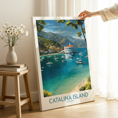 Catalina Island travel poster print with boats and mountains, hand holding framed wall art