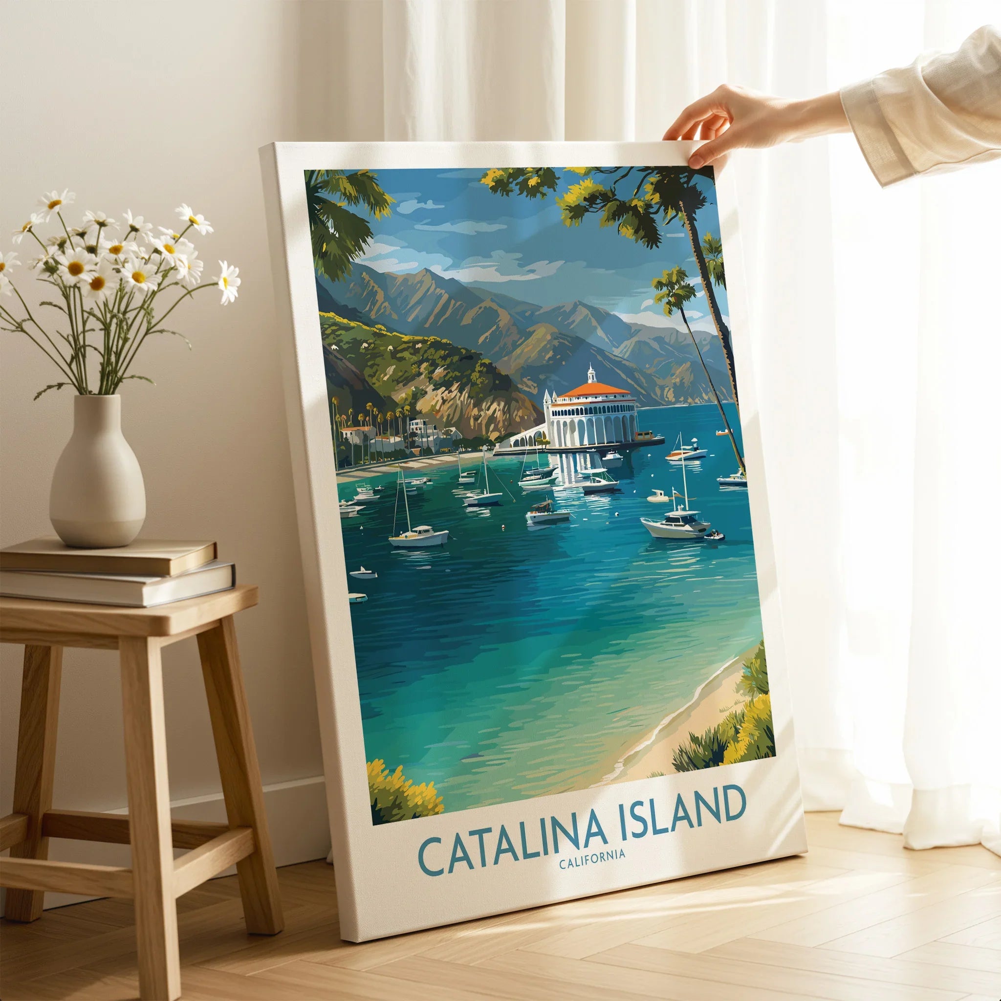 Catalina Island travel poster print with boats and mountains, hand holding framed wall art