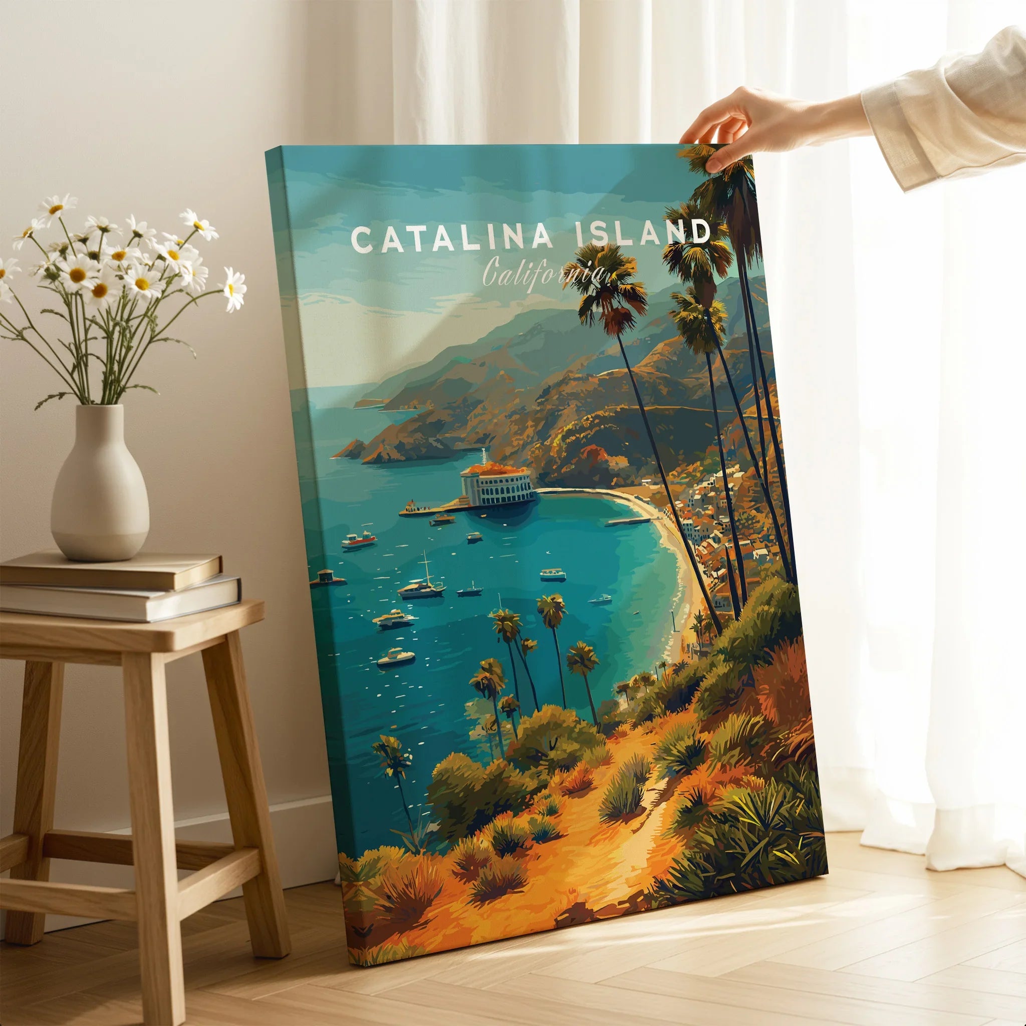 Hand holding Catalina Island travel poster print in modern home decor setting