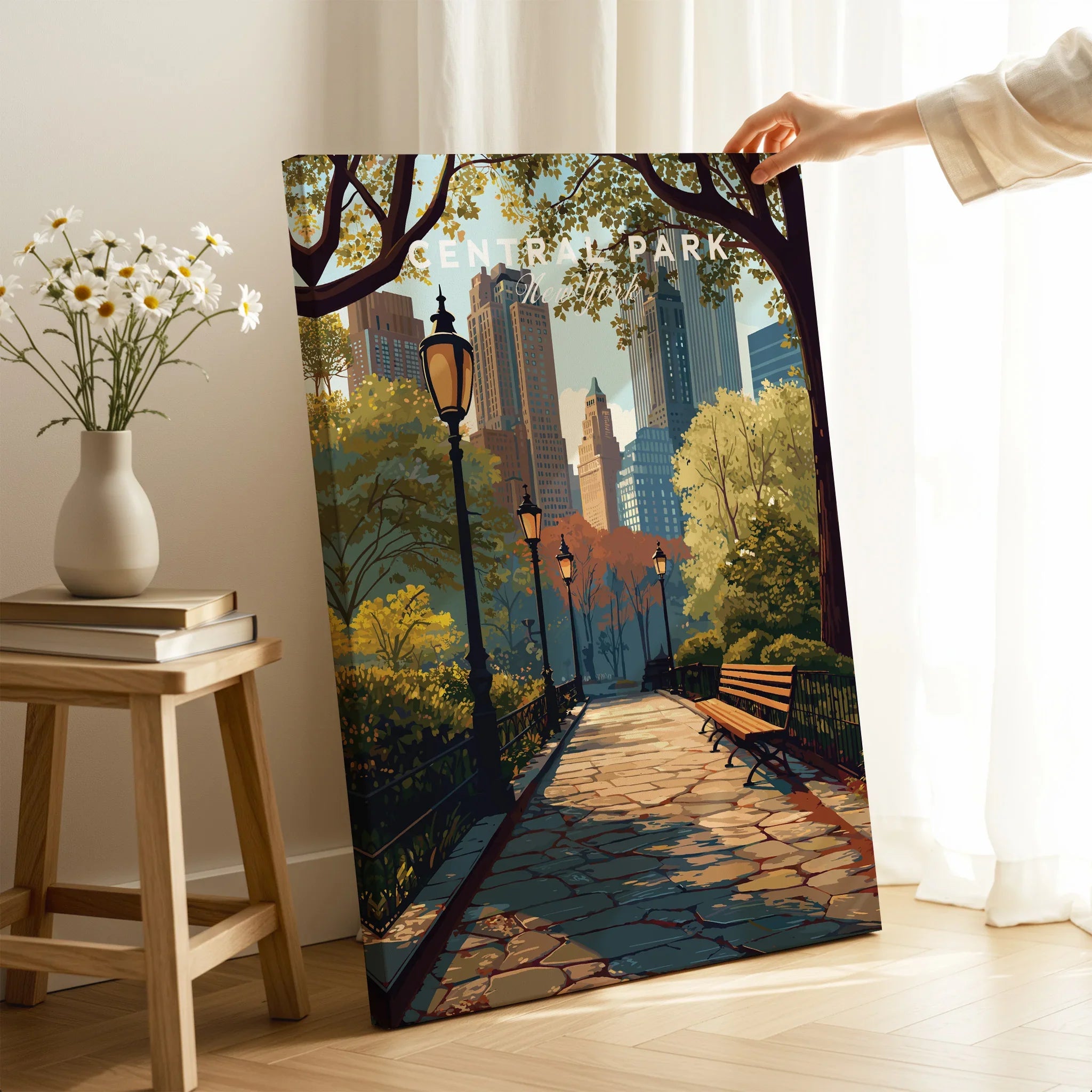Central Park canvas print with city skyline, hand holding art in modern room setting