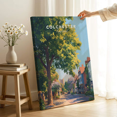 Colchester England art print with tree-lined street, held in bright modern room decor
