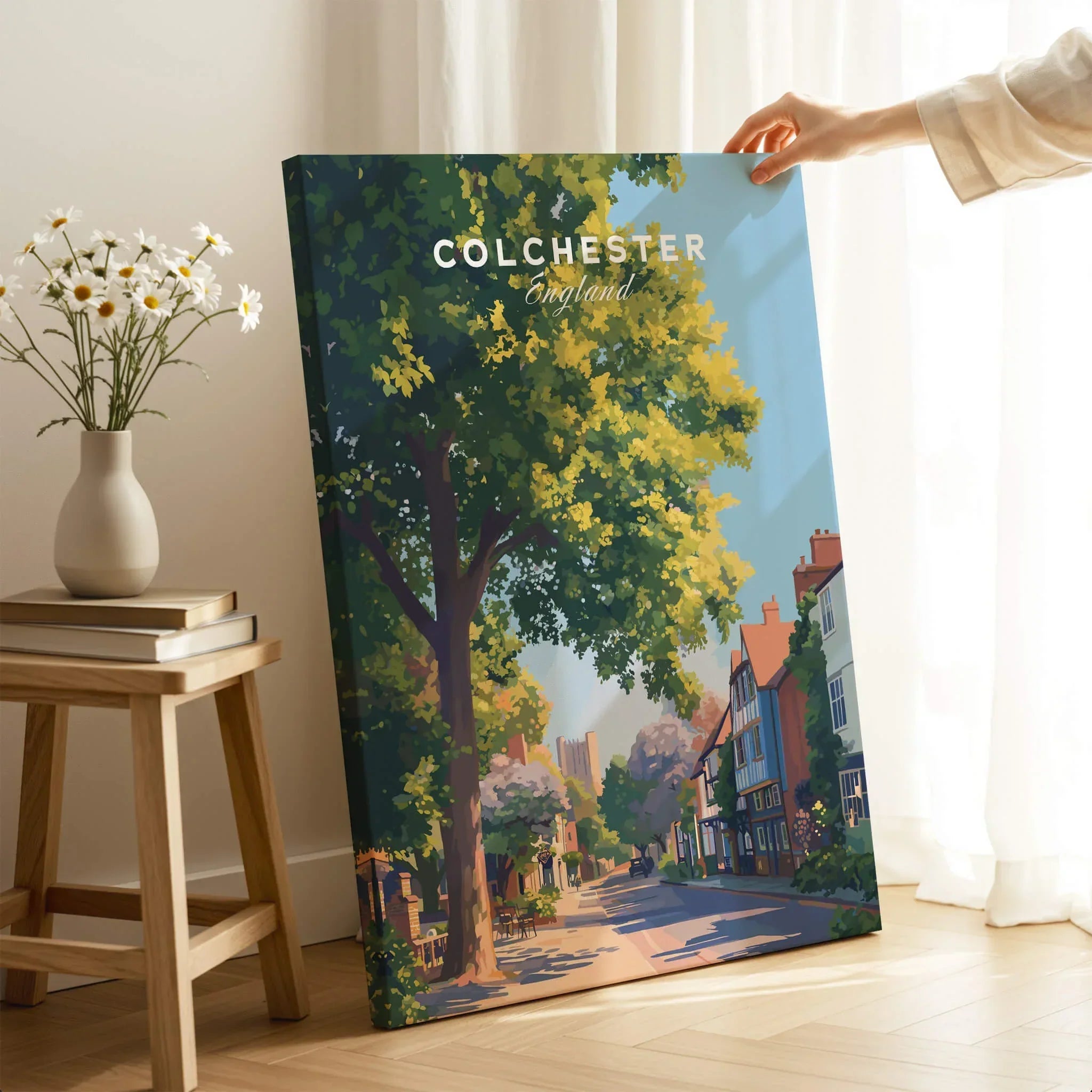 Colchester England art print with tree-lined street, held in bright modern room decor