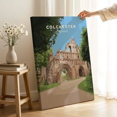 Colchester England travel poster canvas print with hand holding it in modern home decor setting