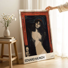 Edvard Munch Art Print - Madonna 1895 Color Lithograph Symbolist Poster displayed on a wooden table with flowers.