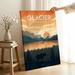 Hand holding Glacier National Park canvas print with sunset mountains and wildlife in modern room