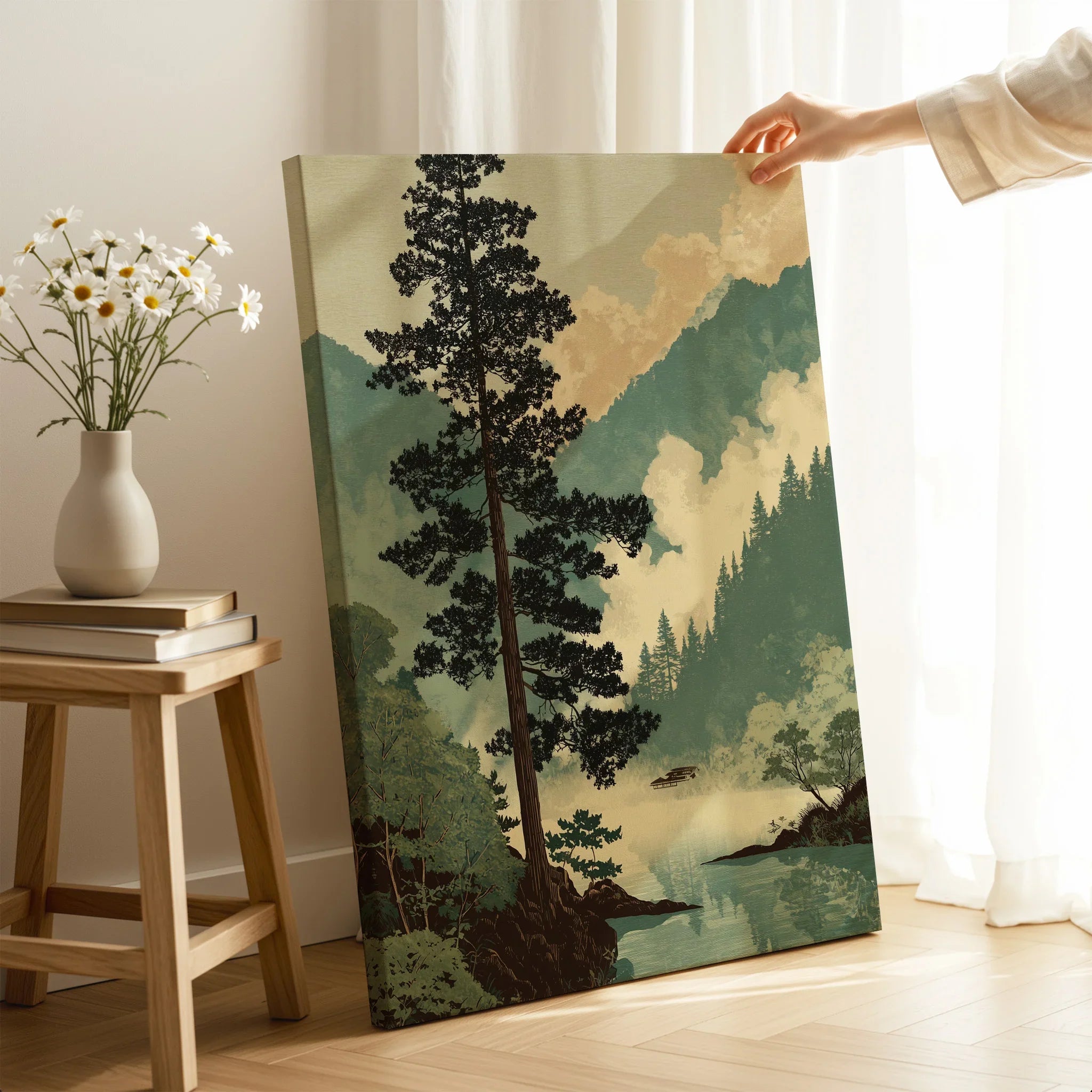 Hand holding Japanese woodblock inspired landscape canvas print in cozy room setting