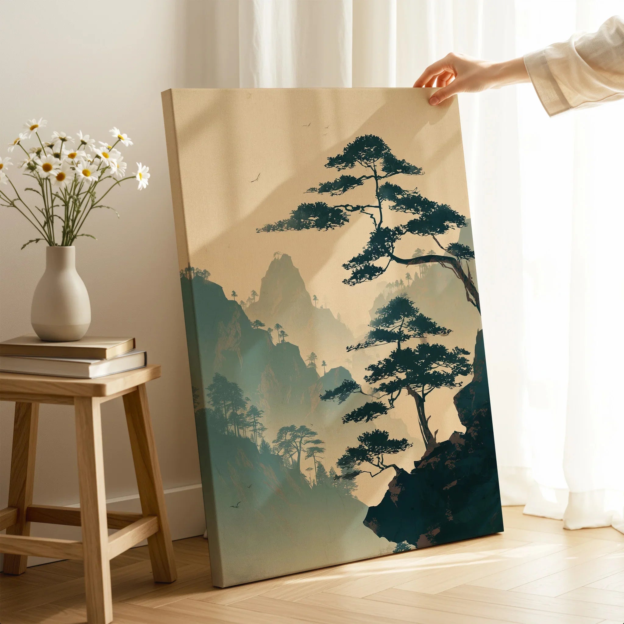 Hand holding Japanese woodblock canvas print with misty mountain landscape, home decor