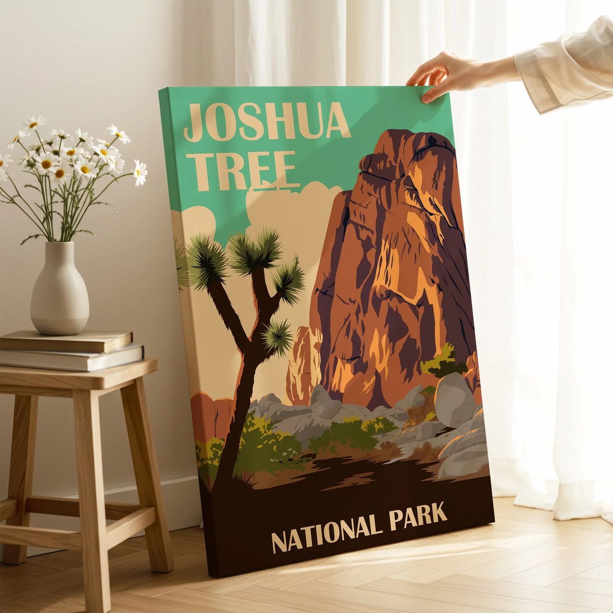 Hand holding a Joshua Tree National Park canvas print in a modern home decor setting