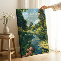 Hand holding Kew Gardens wall art print showing a botanical garden landscape in a cozy room
