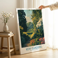 Hand holding Kew Gardens canvas print with botanical landscape, modern home decor setting