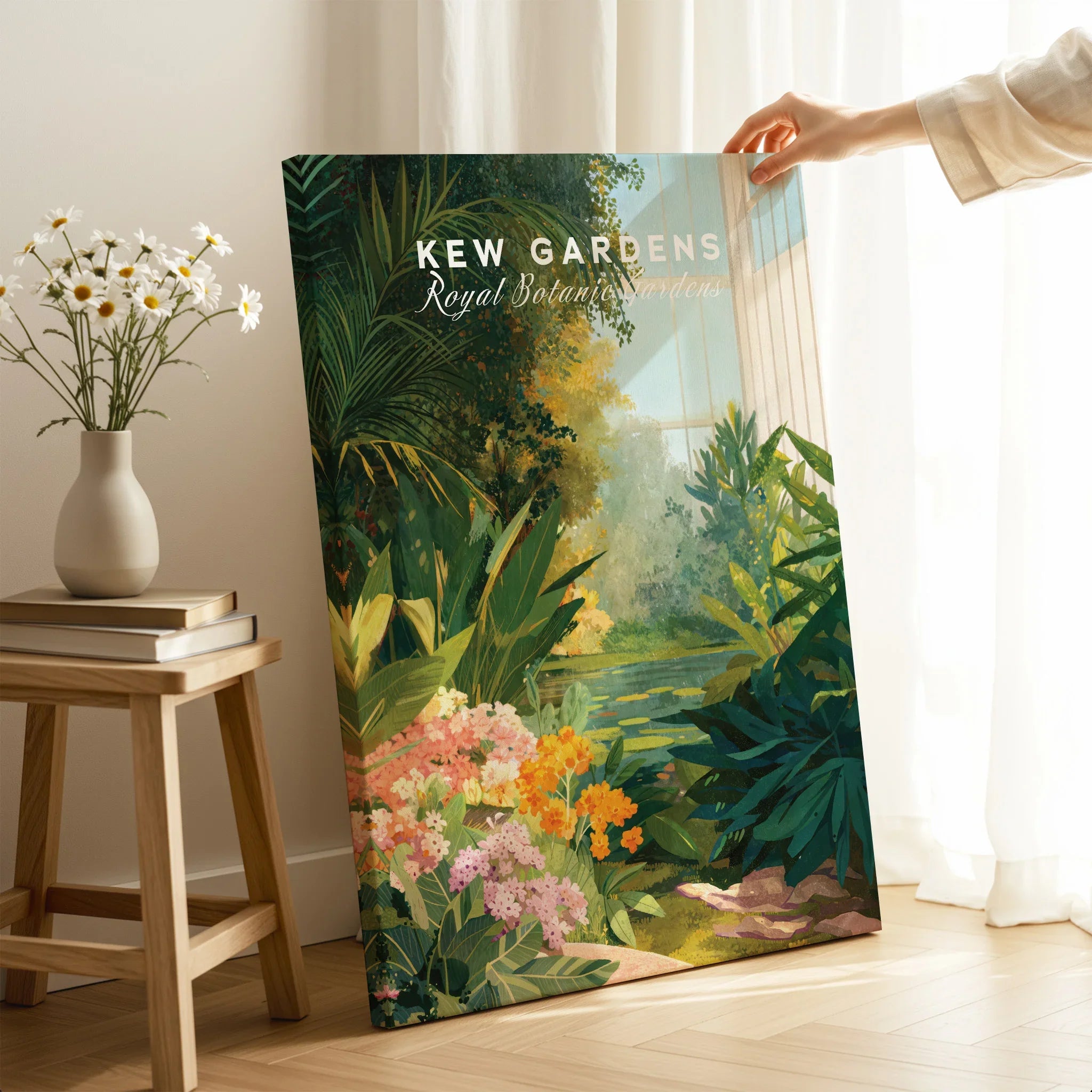 Hand holding Kew Gardens botanical art print with colorful flowers in bright room