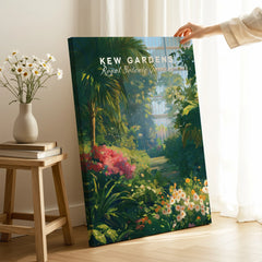 Hand holding Kew Gardens canvas print with lush botanical garden illustration in home setting