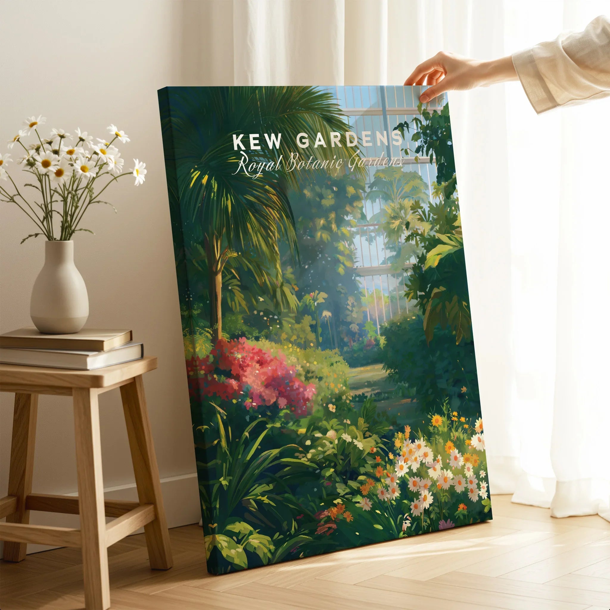 Hand holding Kew Gardens canvas print with lush botanical garden illustration in home setting