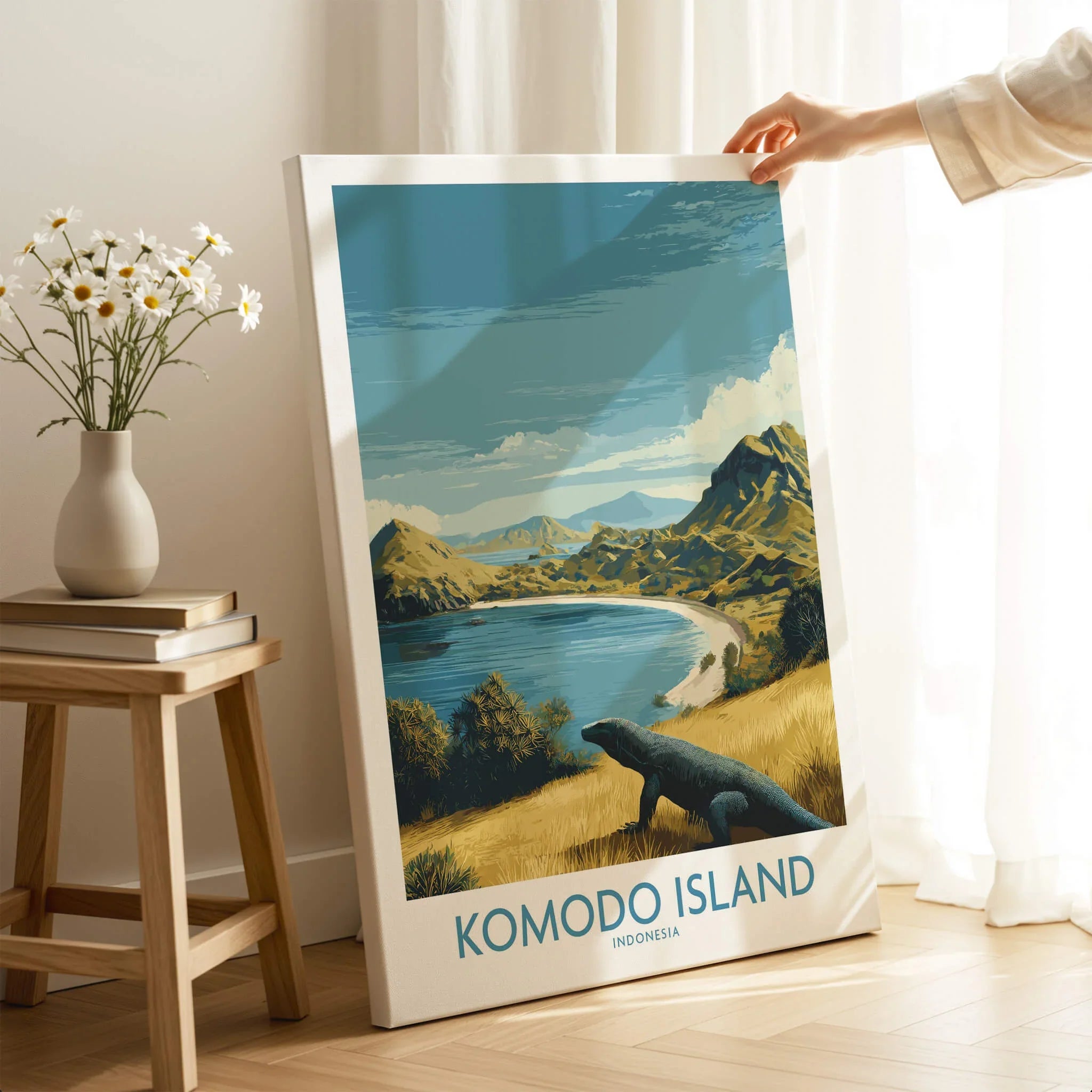 Hand holding Komodo Island travel poster print with scenic landscape, modern home decor