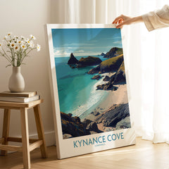 Kynance Cove Cornwall Poster | Scenic Sea Cliffs & Beach Canvas Print displayed in a cozy room with flowers.