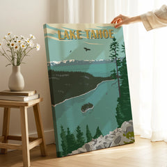 Hand holding Lake Tahoe canvas print with retro travel poster design in a cozy room setting