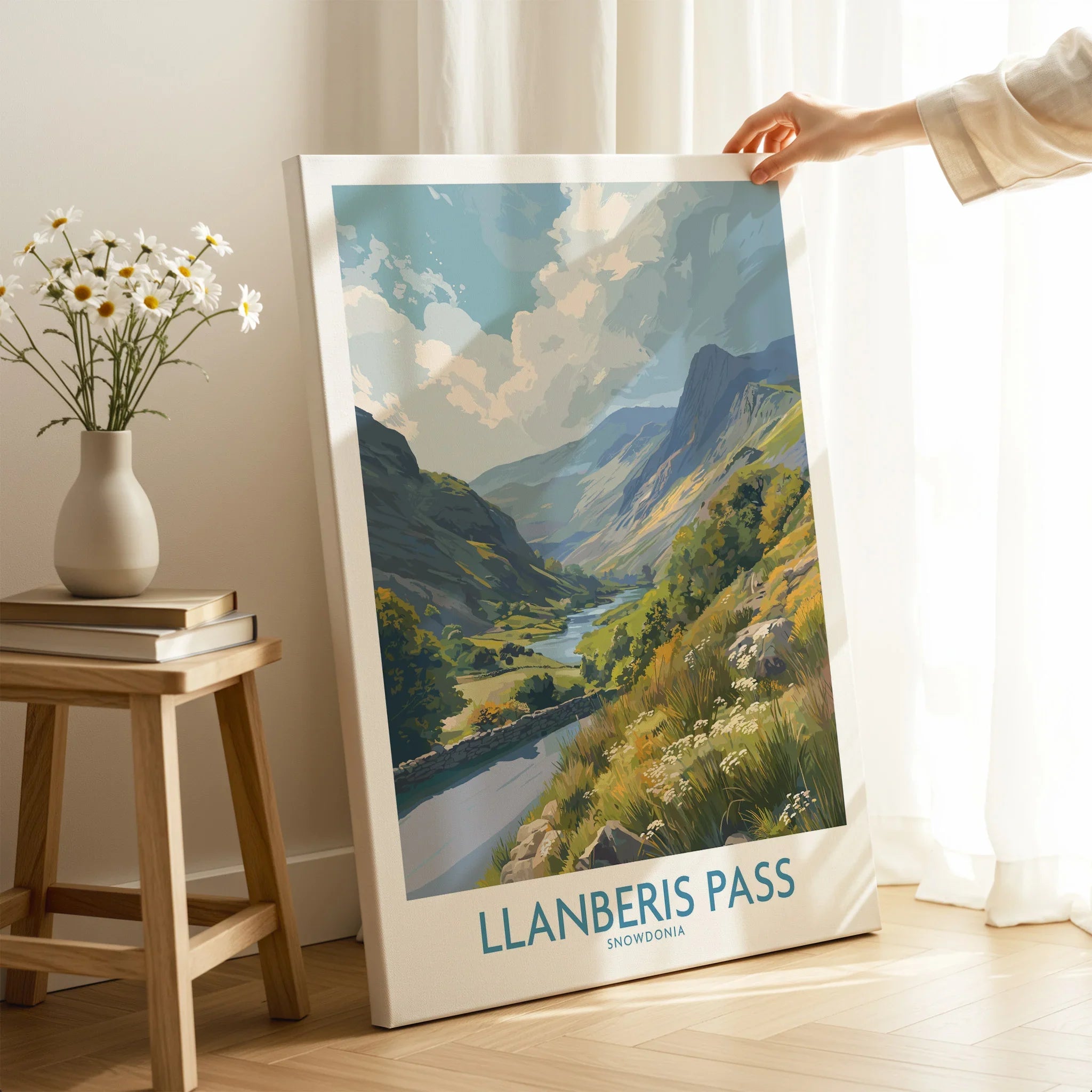 Llanberis Pass Snowdonia travel poster canvas print in bright modern room with hand holding it
