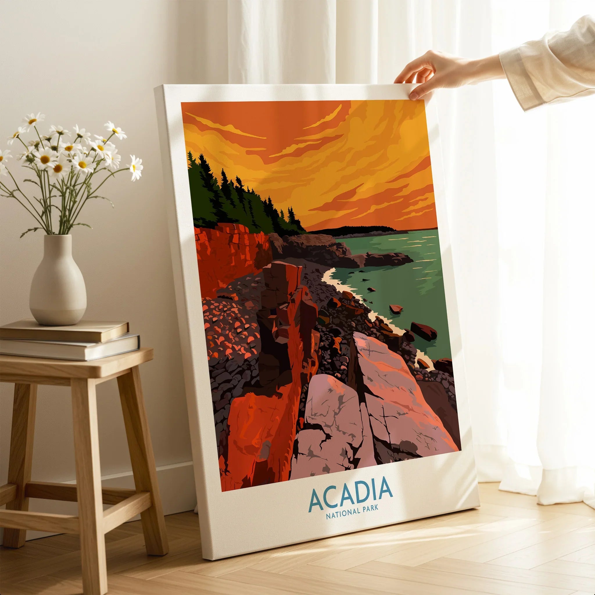 Hand holding canvas print of Acadia National Park landscape art in a cozy room setting