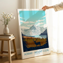 Hand holding Aoraki Mount Cook National Park travel poster canvas in modern home decor setting