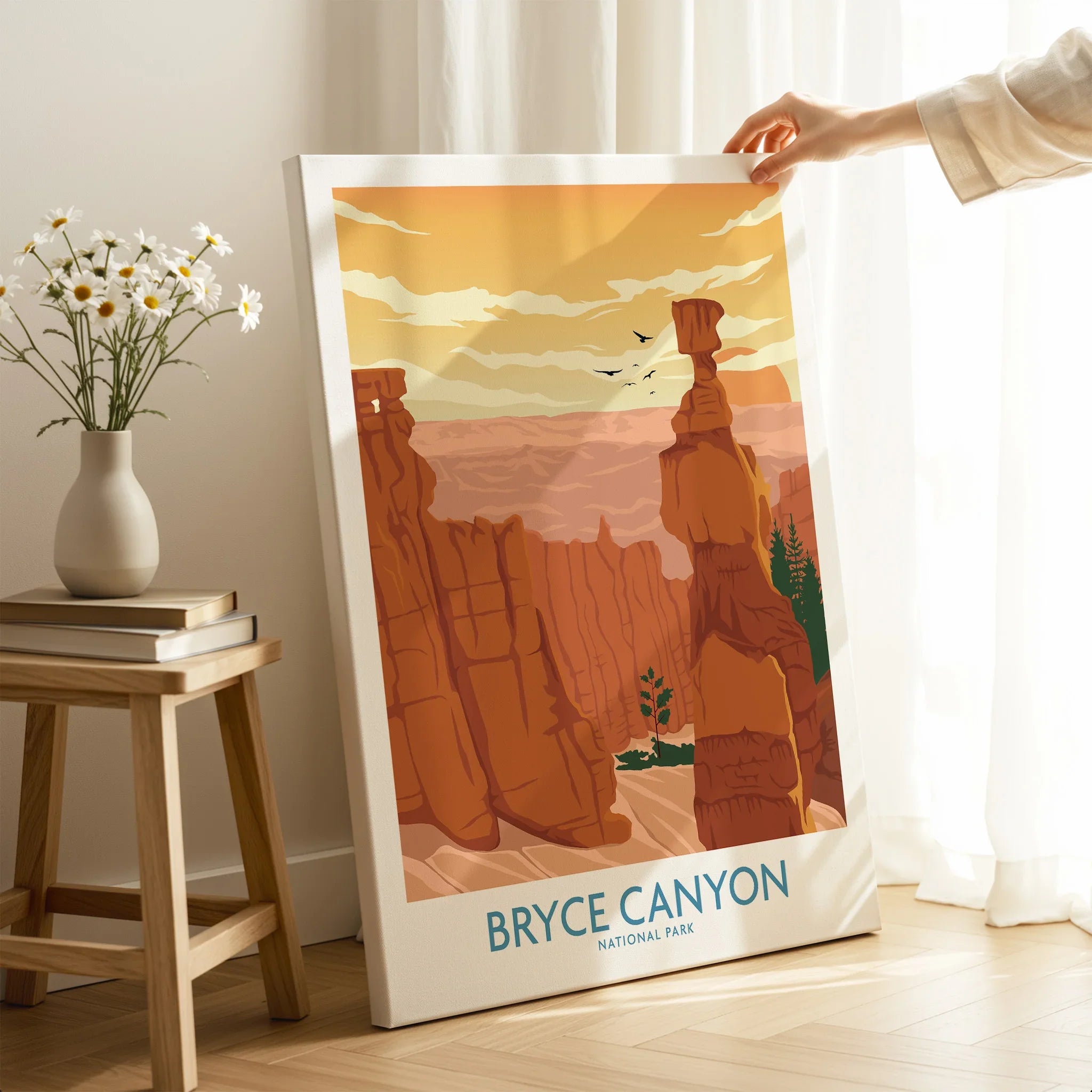 Bryce Canyon National Park canvas wall art with orange rock formations, held in a sunlit room.