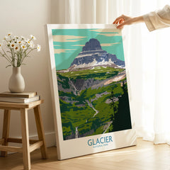 Hand holding Glacier National Park canvas print in bright room with daisies on table