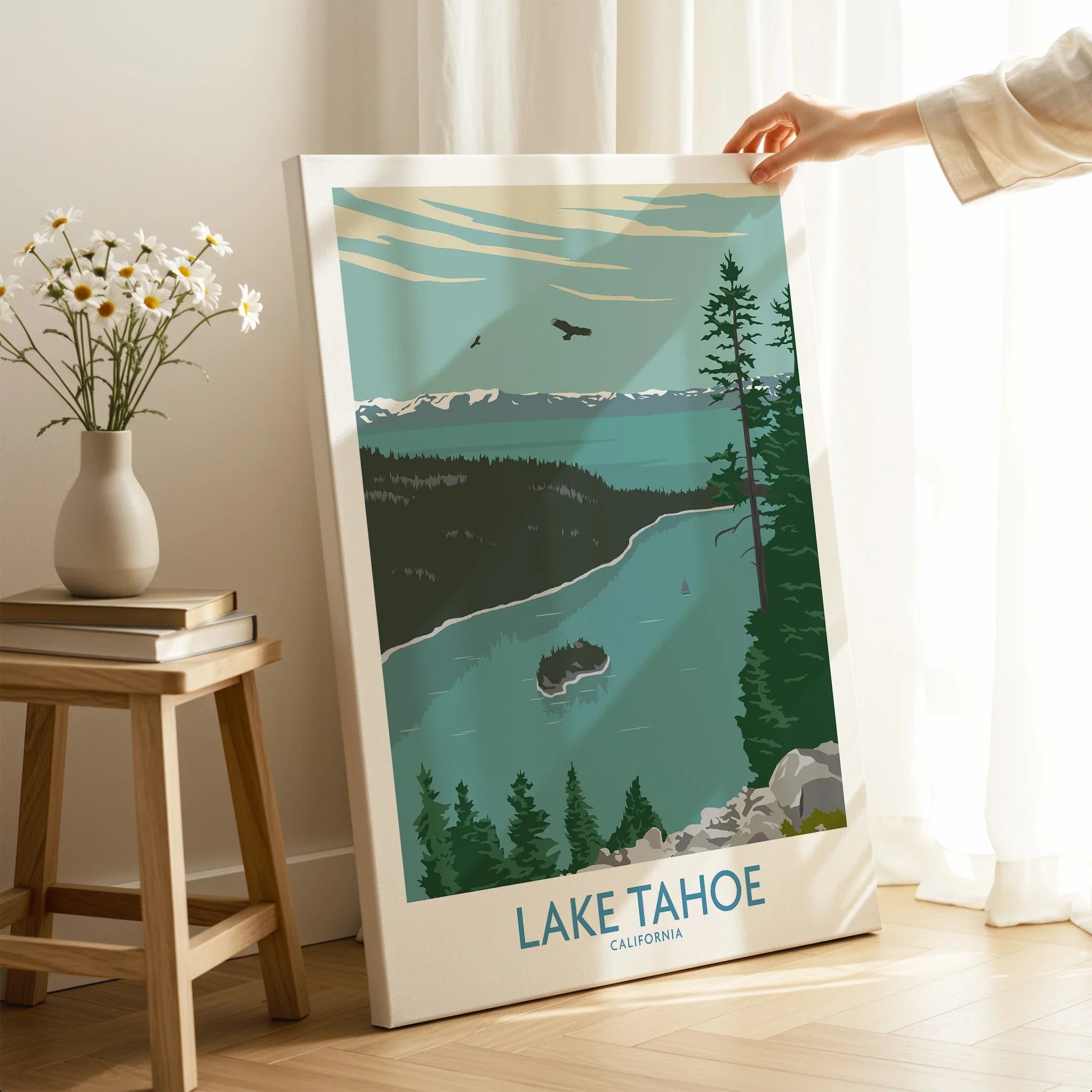 Lake Tahoe California canvas wall art print in modern room setting with a hand holding it