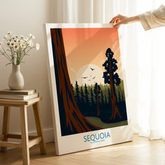 Hand holding Sequoia National Park canvas print in cozy room with flowers on stool