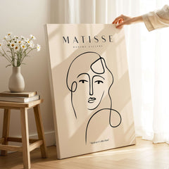 Matisse Art Prints - Continuous Line Abstract Face Poster displayed in a modern setting with neutral tones.