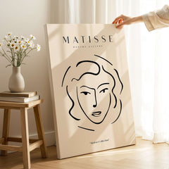 Matisse Art Prints - Abstract Line Face Drawing displayed in a stylish interior setting with minimalist decor.