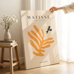 Matisse Art Prints - Orange Leaf Bird Silhouette Poster displayed in a modern room with natural light.