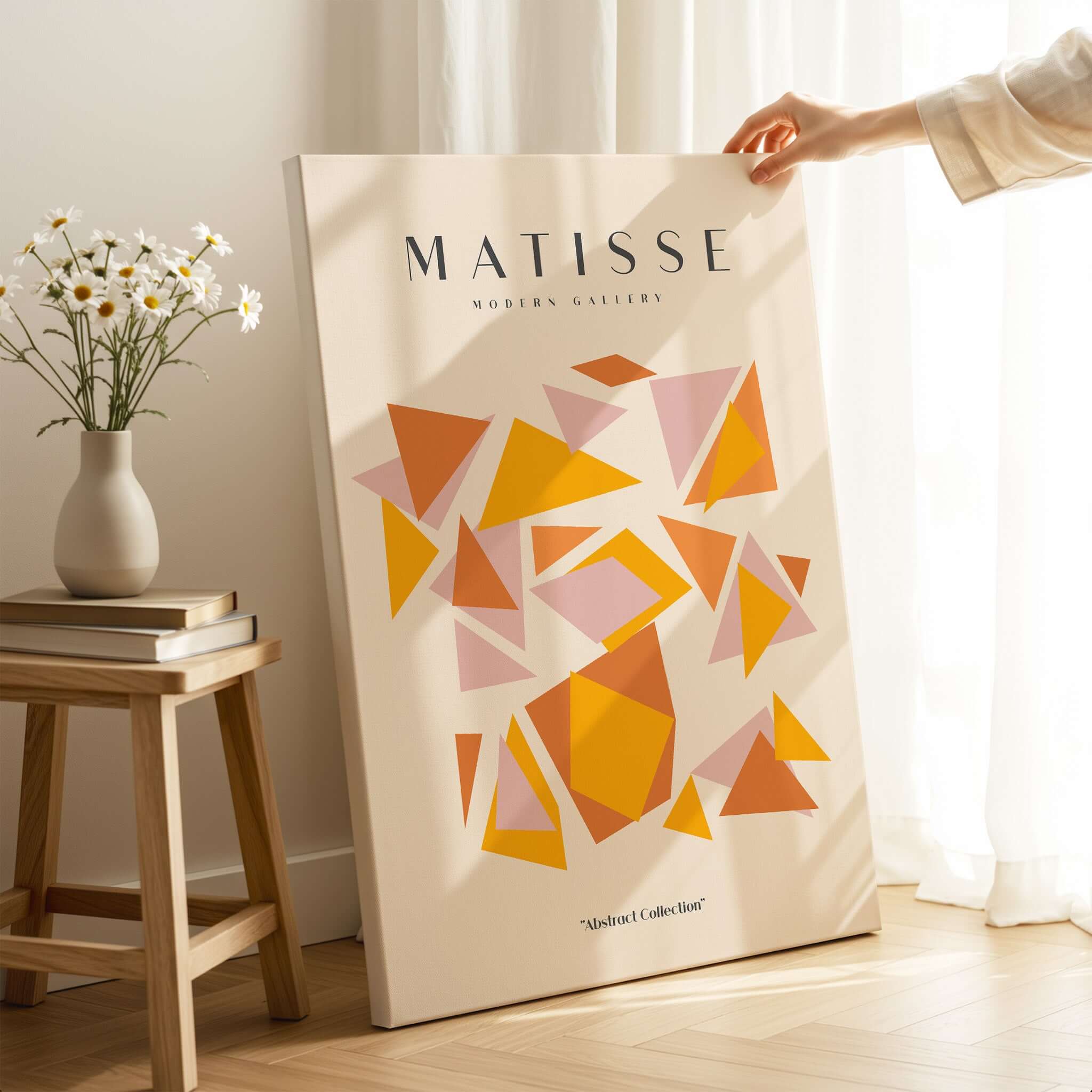 Matisse Art Prints - Warm Tone Geometric Triangles Poster displayed next to a vase of flowers in a cozy interior.