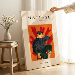Matisse Art Prints - Seated Figure in Cap Poster featuring a bold figure against a vibrant orange background.
