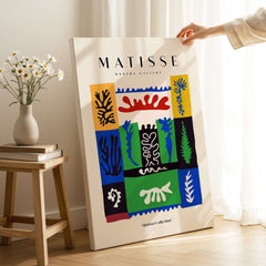 Matisse Art Prints -  Complex Abstract Botanical Patchwork Poster displayed next to flowers in a modern gallery setting.