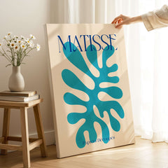 Matisse Cyan Blue Abstract Shape Papiers Découpés Poster showcasing vibrant blue shape against beige background.