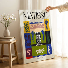 Matisse Amphitrite 1947 Abstract Patchwork Poster Print displayed beside a vase of flowers.